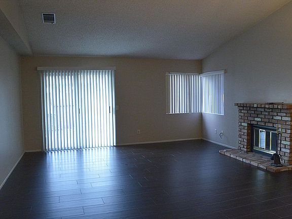 Living room leading to backyard patio.