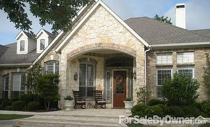 Austin Stone Entry and Walkway
						:
						Matching stonework around all flowerbeds