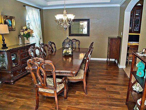 To the left of the front door, you can Imagine making wonderful holiday memories in this light dining room.