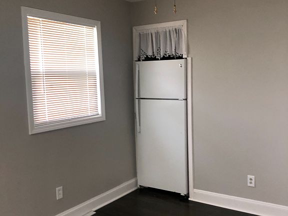 The dining area can fit a table with four chairs.