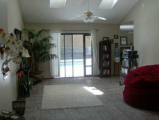 Living room opens to pool