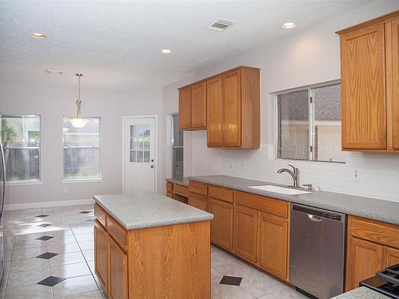 TaaDaa Look at this gorgeous kitchen...Corian countertops for days, new stainless appliances and
