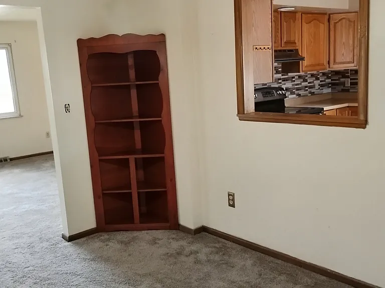 View of the dinning-room next to the upstairs living-room and kitchen
