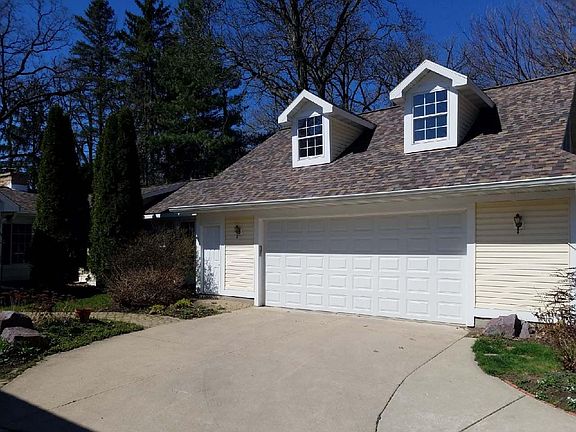Oversize 2 car garage--lots of storage room. Stairs to upper level storage as well.