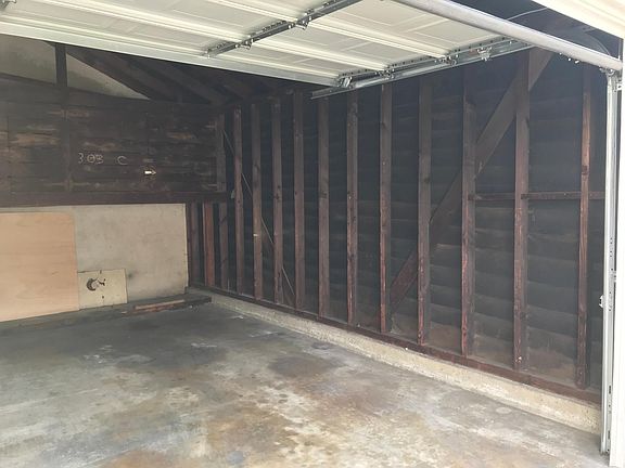 covered parking in lockable garage with ample storage