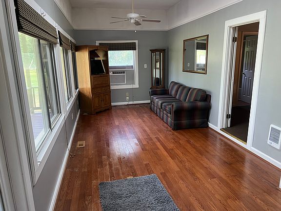Living room with some more furniture in other photos. Hardwood floors, 9 ft ceilings