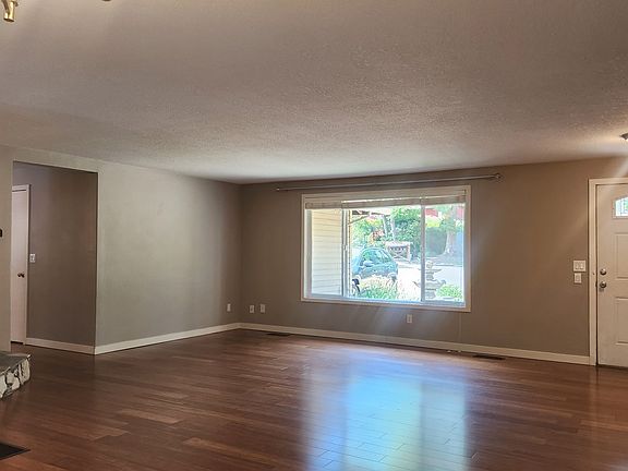 Living room with wood-burning fireplace