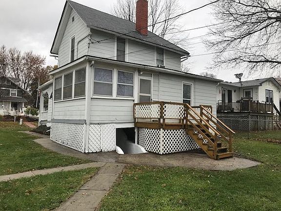 REAR VIEW OF DECK AND SUNROOM
