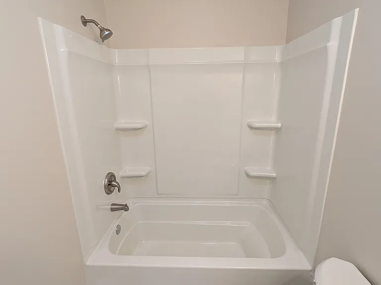 Bathroom is remodeled and features a shower/tub
