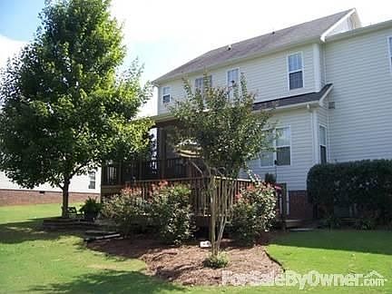 Screened porch, deck and paver patio! : Landscaping throughout includes a sodded yard in the front, 