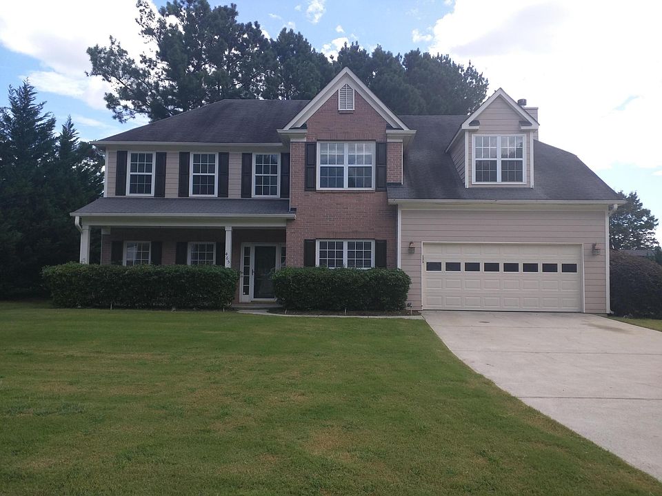 Level yard with wooded, fenced backyard