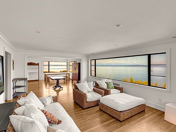 Spacious adjoining dining and living rooms bring you that "great room" feel. Perfect for entertaining large groups. Enjoy the amazing view from almost every room in this gorgeous home.