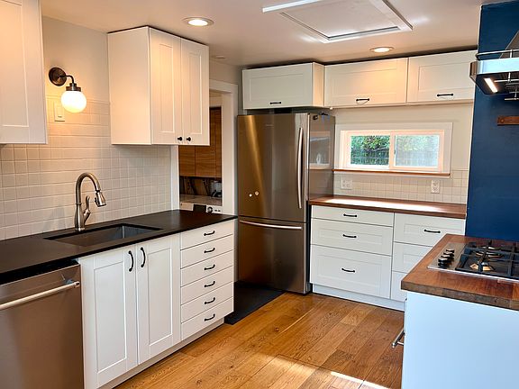 Dishwasher, refrigerator, and stove top are all stainless steel and less than five years old.