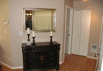 Elegant hall way area with coat closet@