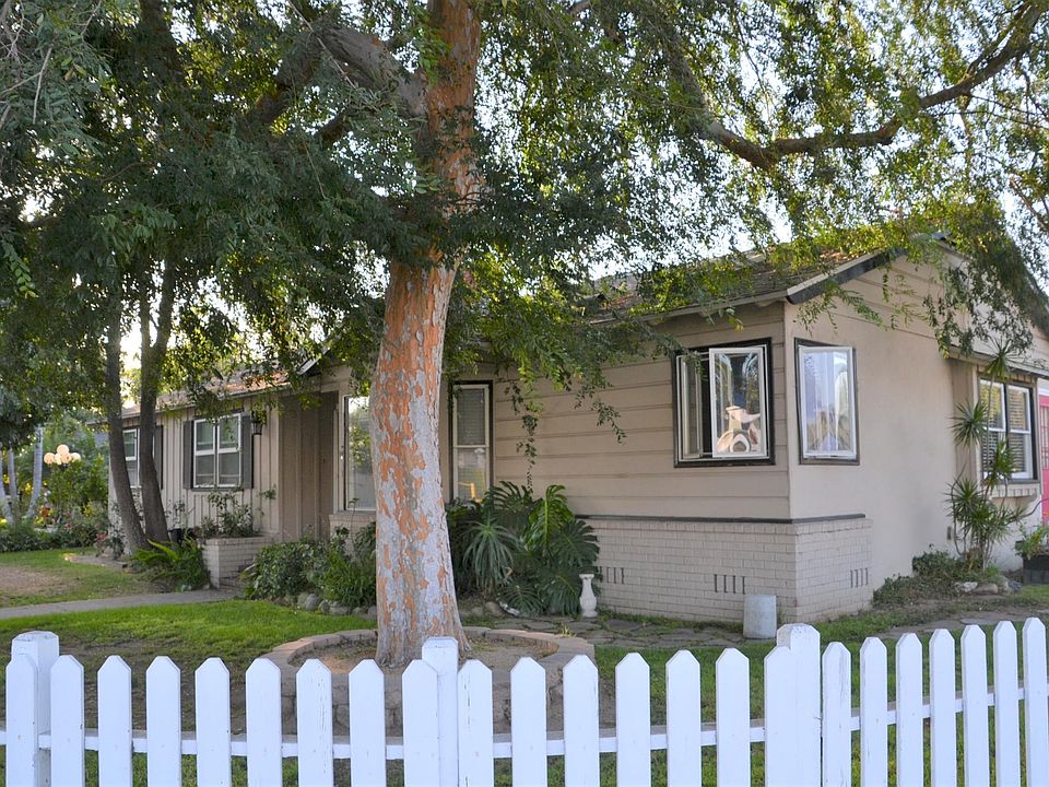 House front and shaded yard