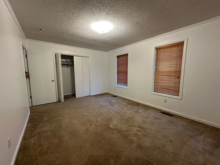 2nd Bedroom on the front side of the home with shampooed carpet