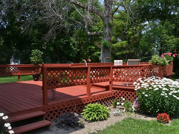 The back deck looks out over the backyard.  It is surrounded with beautiful plantings and was just recently re stained.  The perfect spot to kick back relax and enjoy the peace and quiet of country life.