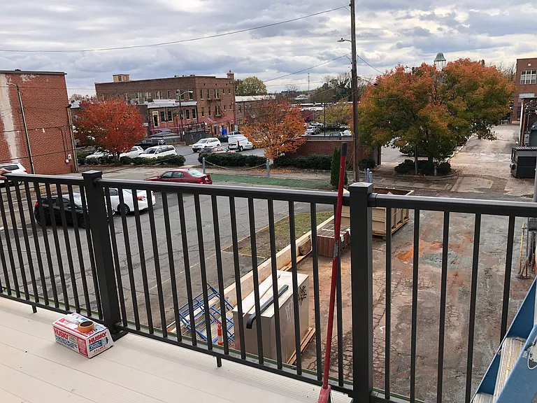 Large 153 SF 10 x 17' rear balcony view. Quiet rear private green garden area.
