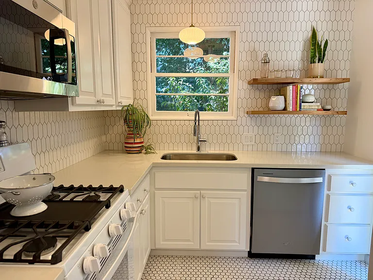 Fully remodeled kitchen, brand new cabinets, new dishwasher, new over the stove microwave with real ducted vent.