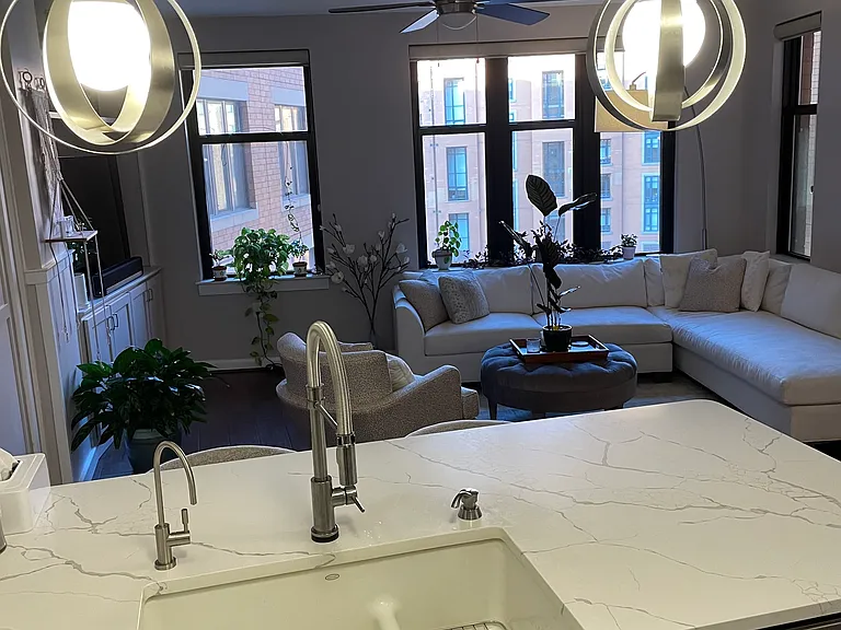 Recently renovated kitchen with large farm sink and bar counter open for entertaining.