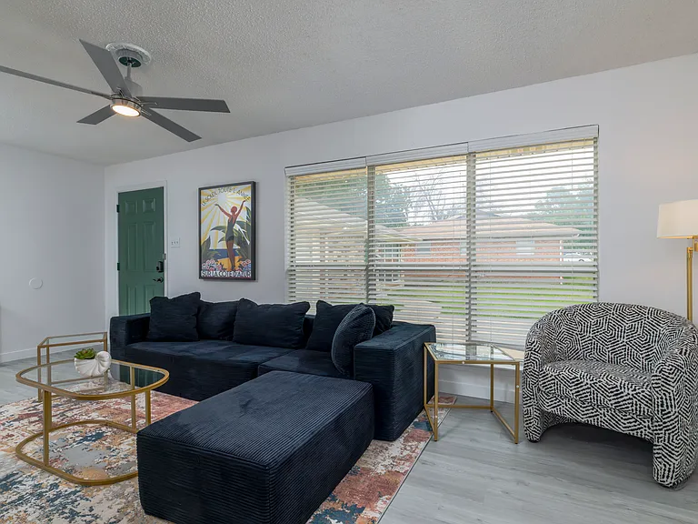 Spacious living room with plenty of seating for friends and family.