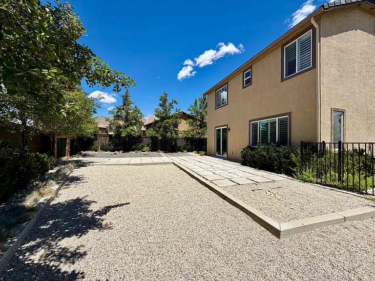 Large corner lot backyard, with low maintenance.