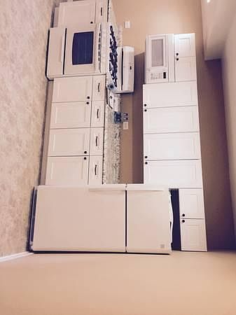 New stove, cabinets, microwave, counter top, sink, fridge