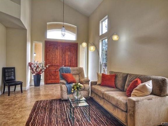 Formal living room with 20" Italian tile floors and cathedral ce