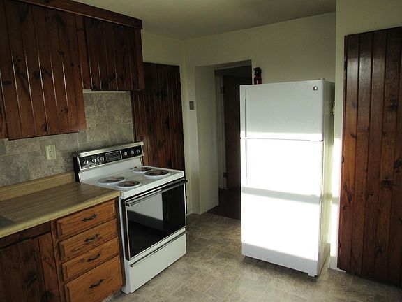 Kitchen with new refrigerator, and new floor and backsplash.