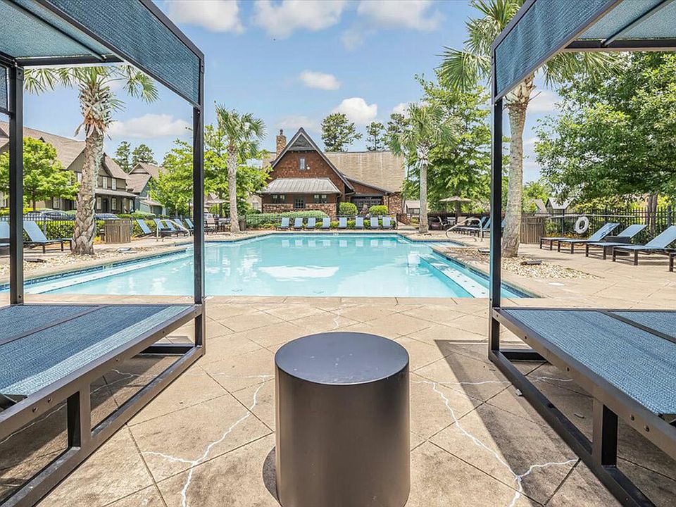 Relax by the resort-style pool at The Cottages of Hattiesburg, perfect for unwinding and enjoying student life.