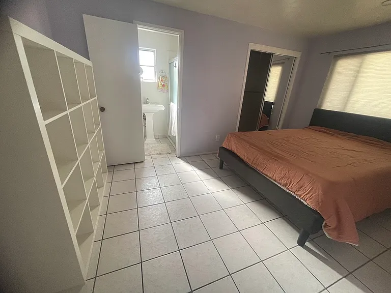 Primary bedroom with bathroom and walk-in closet.