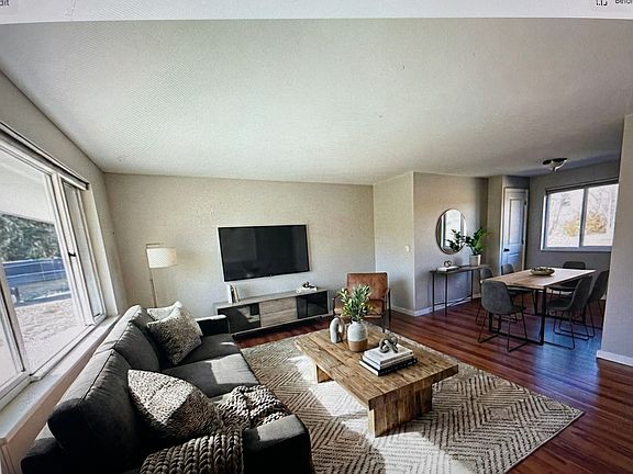Living room /dining area virtually staged.