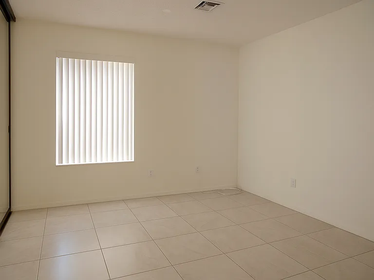 Third bedroom or office. There is a closet on the left with sliding mirrored doors.