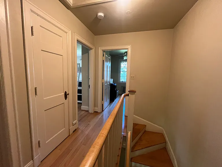 2nd Floor, closed cleaning supplies, bath towels etc.. door, Large rental room on left, smaller room on right