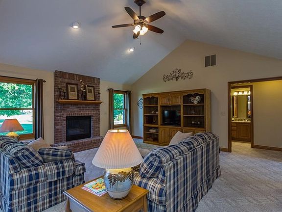 Living Room with gas log fireplace and cathedral ceiling