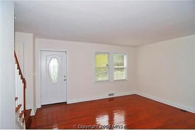 Living Room with Gleaming Hardwoods and Newer Windows