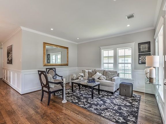 Inviting entry shows crown molding and beautiful window trim.