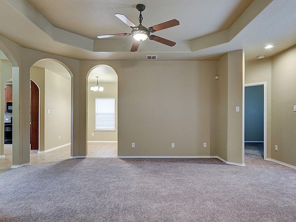 Living Room with Dining Room in front, Kitchen to the left, Master Bedroom to the right
