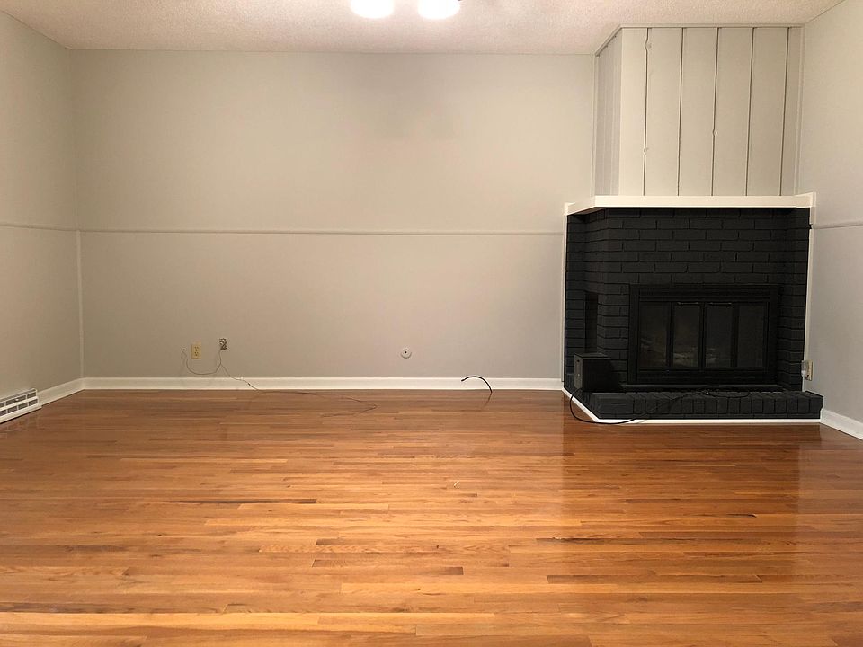 Renovated family room with new hardwood floors. It's great having a family room right off the back patio and conveniently located next to the kitchen.