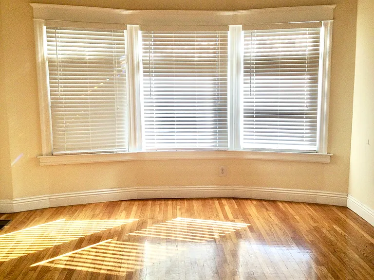 Spacious private bedroom in USC student housing with hardwood floors and natural light - ideal for graduates