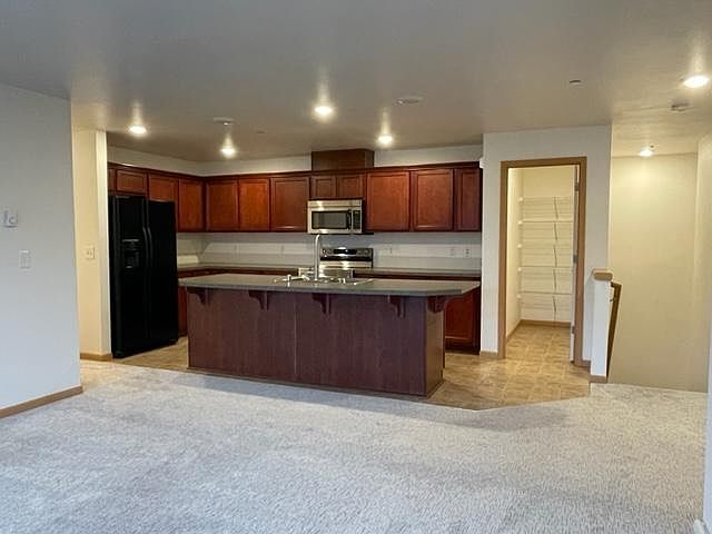 Kitchen and walk-in pantry from main living space.