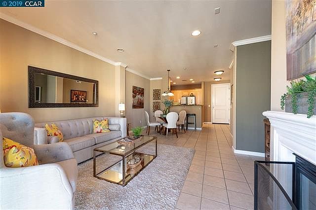 Spacious Living/Dining with Fireplace opens to the balcony