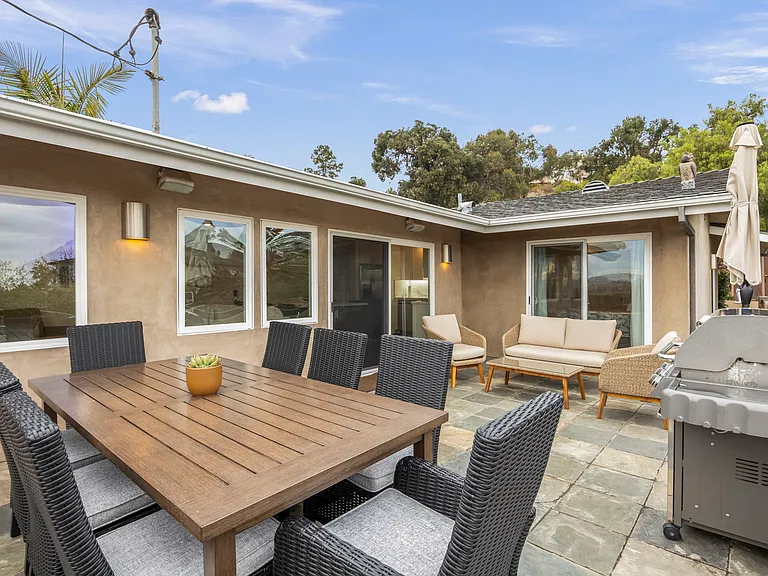 Deck accessible from sliding doors off kitchen and 2 of the 3 bedrooms.