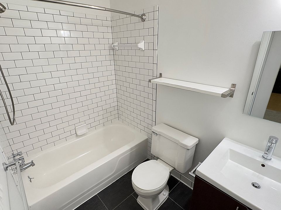 Newly remodeled upscale bath with wood plank flooring