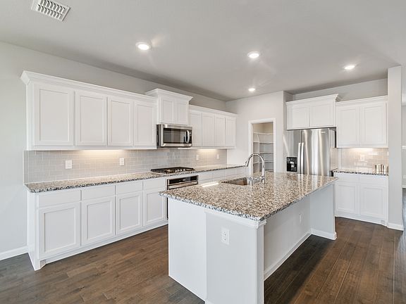 Kitchen in the Ryder home plan by Trophy Signature Homes