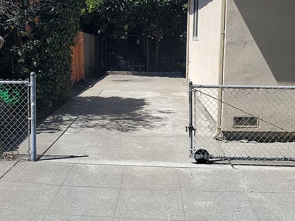 Please walk up the private exclusive use driveway to the entrance. It fits 2 cars tandem easily, behind the rolling gate.