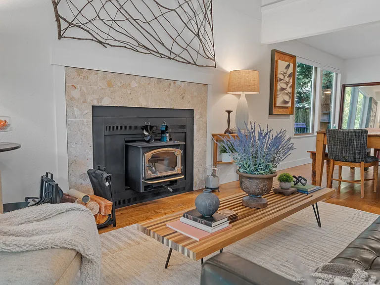 View of living and dining room side glass windows with natural light