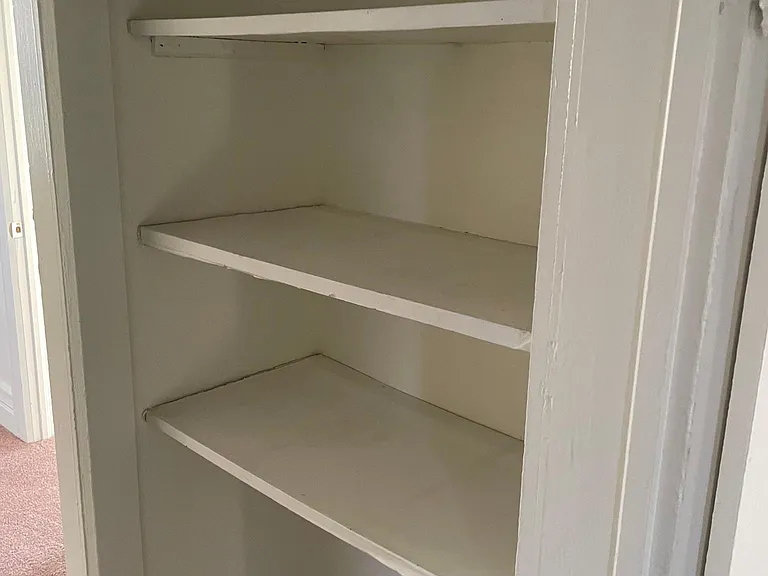 Storage area under stairway with walk thru to down Bedroom