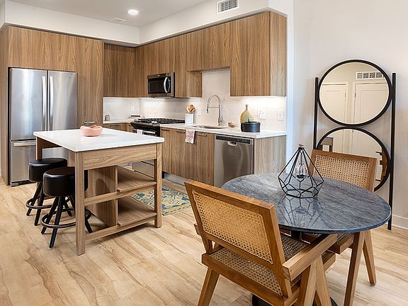Gourmet kitchens with chefs-island with storage, stainless steel appliances and gas cooking