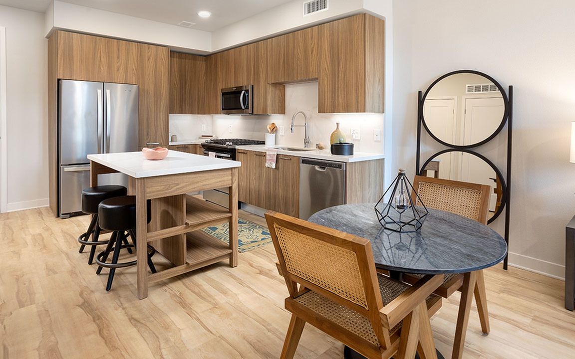 Gourmet kitchens with chefs-island with storage, stainless steel appliances and gas cooking